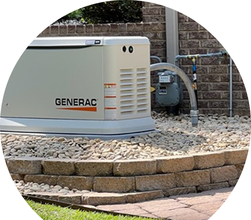Generac standby generator installed by Anchor Home Comfort on a raised stone platform beside a brick wall, connected to a natural gas meter for backup power supply. Generac standby generator installed by Anchor Home Comfort on a raised stone platform beside a brick wall, connected to a natural gas meter for backup power supply.