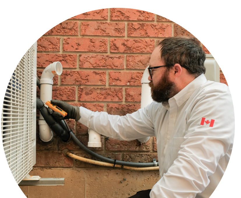 Anchor Home Comfort HVAC specialist checking insulated piping on a heat pump unit beside a brick wall during a diagnostic service. Anchor Home Comfort HVAC specialist checking insulated piping on a heat pump unit beside a brick wall during a diagnostic service.