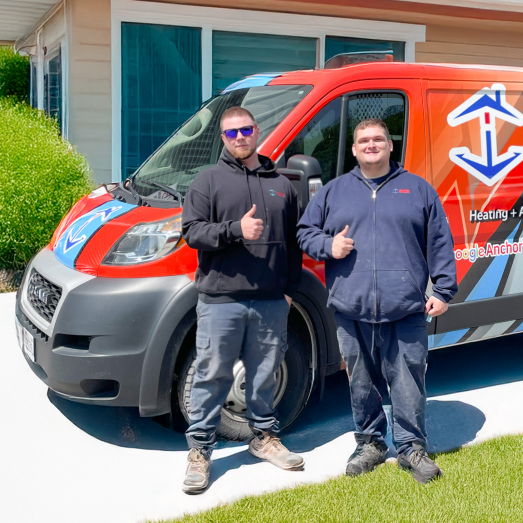 Anchor Home Comfort Plumbing technician standing by our famous green trucks in a residential neighbourhood. Anchor Home Comfort Plumbing technician standing by our famous green trucks in a residential neighbourhood.
